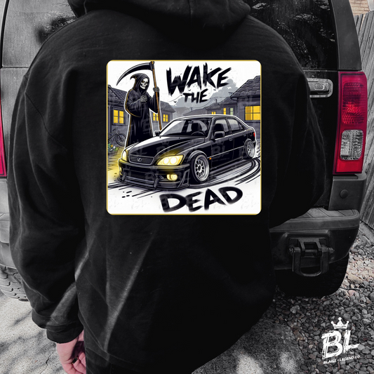 Black hoodie featuring a bold graphic of a Grim Reaper holding a scythe next to a sleek JDM car with the text 'Wake the Dead,' set against a dark and moody backdrop.